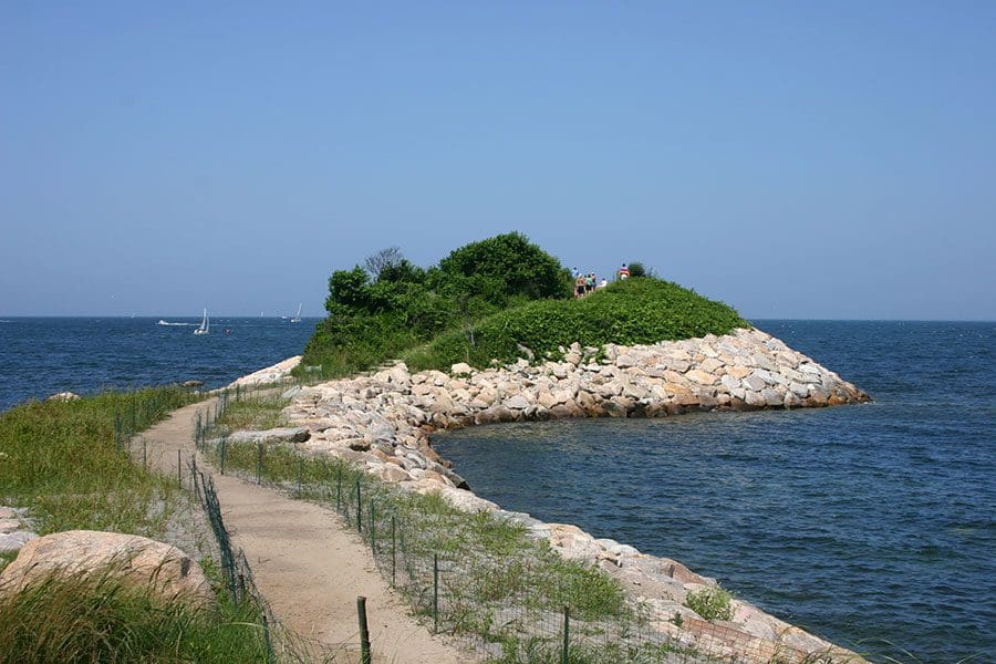 A small island in the middle of an ocean.