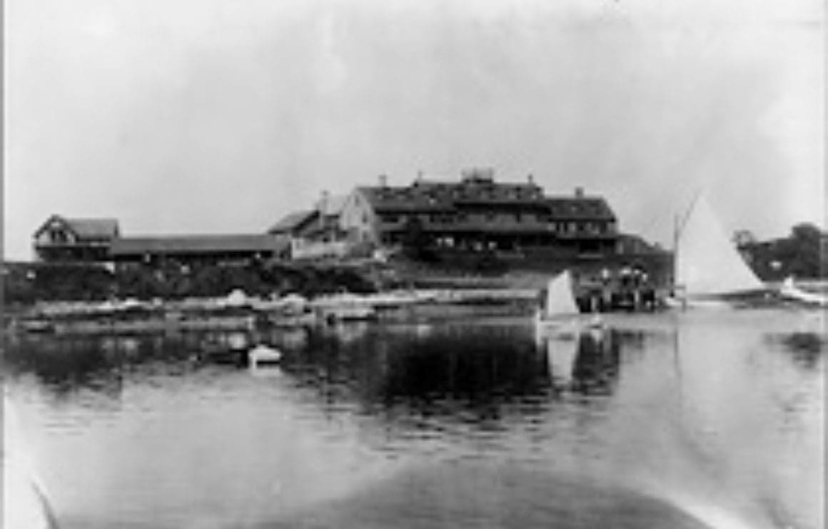 A large building sitting on top of a body of water.