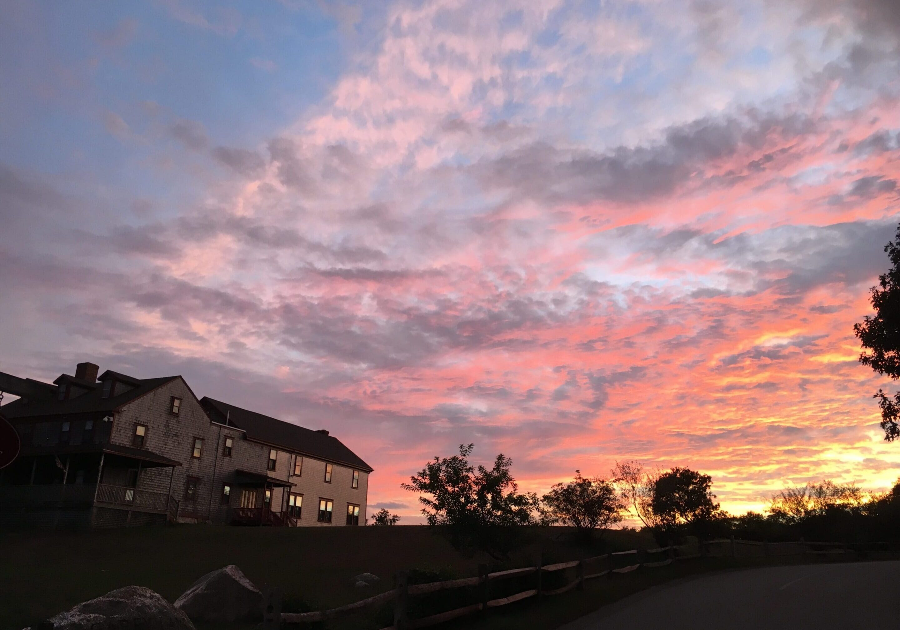 A sunset with pink clouds in the sky.